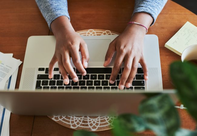 Birdseye view of woman typing on computer