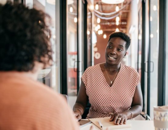 Two women having business discussion