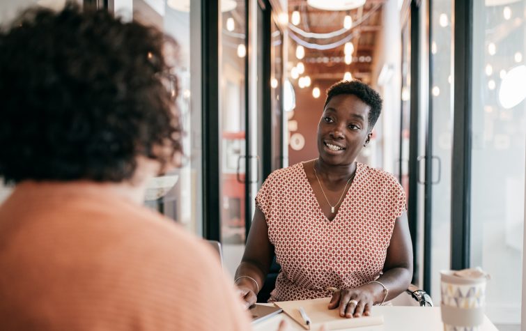 Two women having business discussion