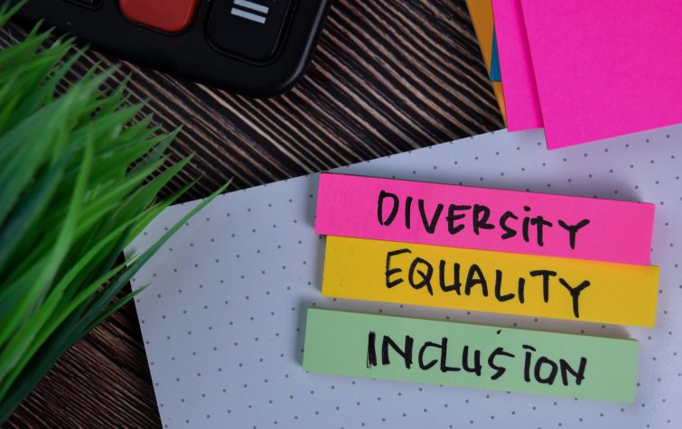 Diversity Equality Inclusion write on a sticky note isolated on Office Desk.