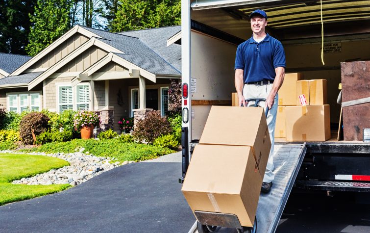 Photo of a delivery man unloading (or loading) truck