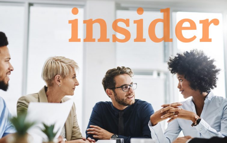 Team meeting around table with the word insider