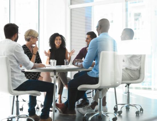 businesswoman brainstorming with her colleagues during a meeting in the boardroom