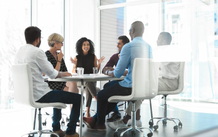 businesswoman brainstorming with her colleagues during a meeting in the boardroom