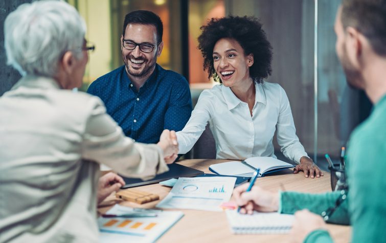 Businesswomen shaking hands in the office