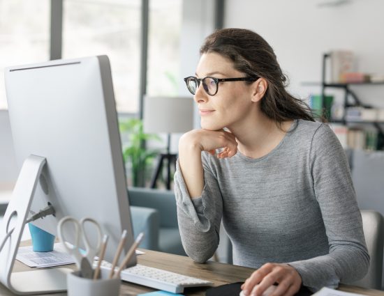 Woman at computer working from home