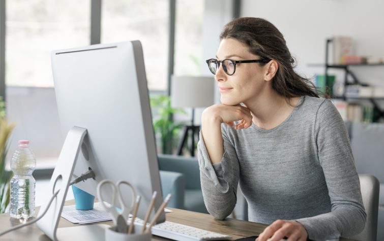 Woman at computer working from home