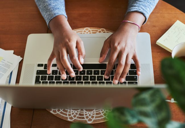 Birdseye view of woman typing on computer