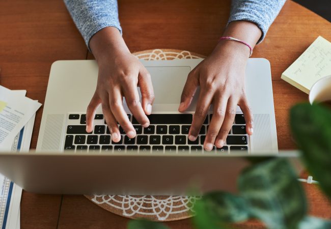 Birdseye view of woman typing on computer