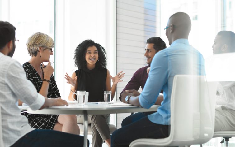 businesswoman brainstorming with her colleagues during a meeting in the boardroom