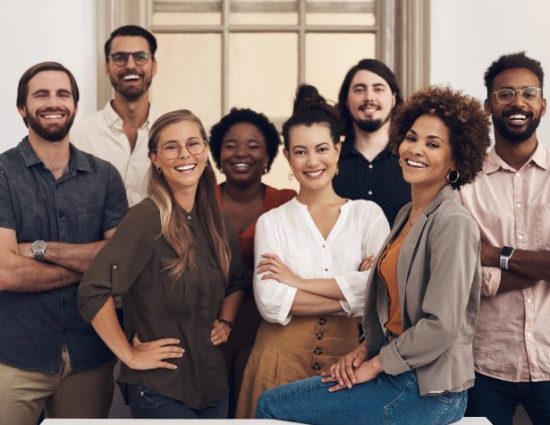 Portrait of a group of smiling businesspeople standing together in an office