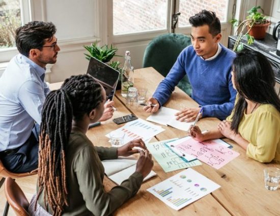 Diverse coworkers meeting at office