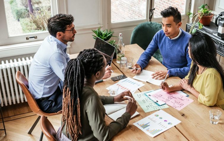 Diverse coworkers meeting at office