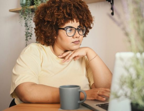 Woman working on computer at home