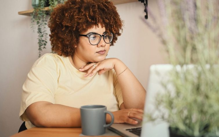 Woman working on computer at home