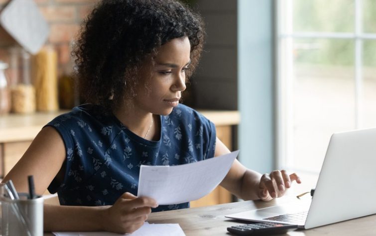 Woman looking at bills