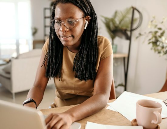 Young woman working at kitchen table