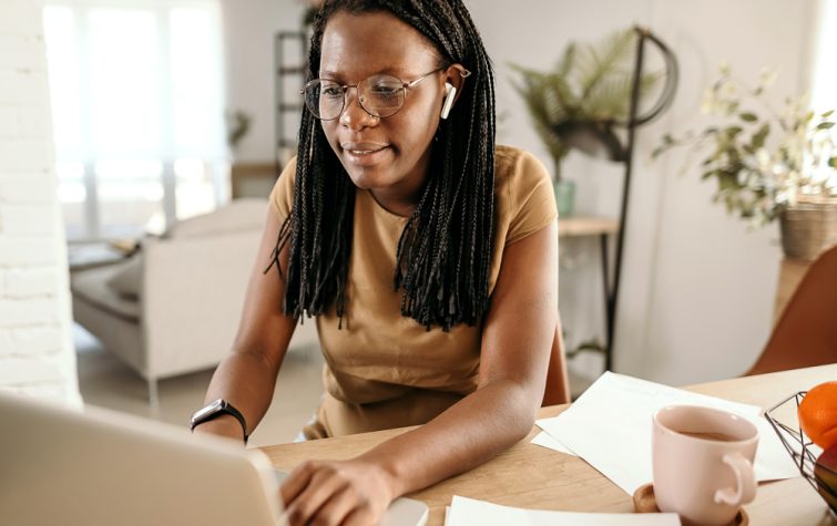 Young woman working at kitchen table