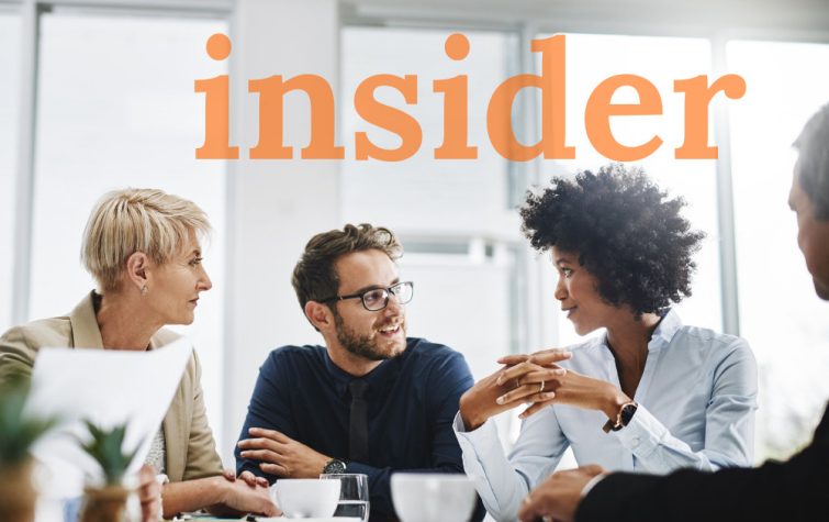 Team meeting around table with the word insider