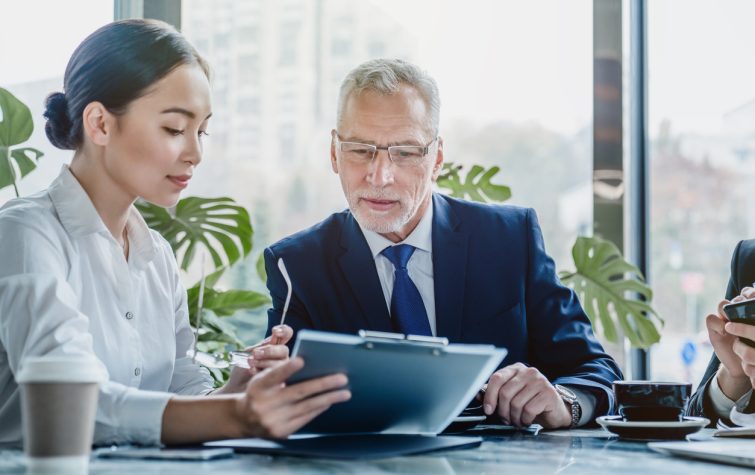 Woman at the office showing a document to a man