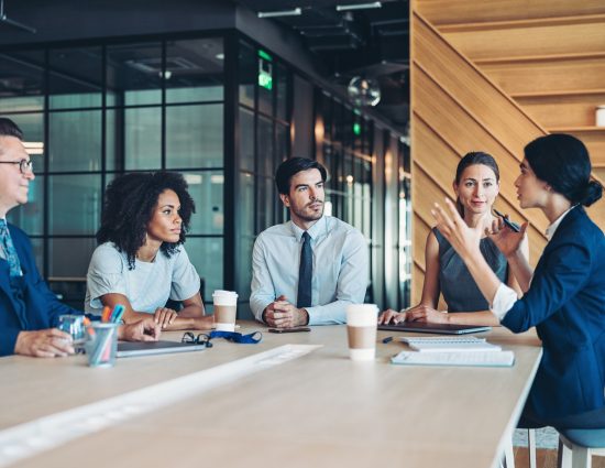 5 co-workers at a business meeting