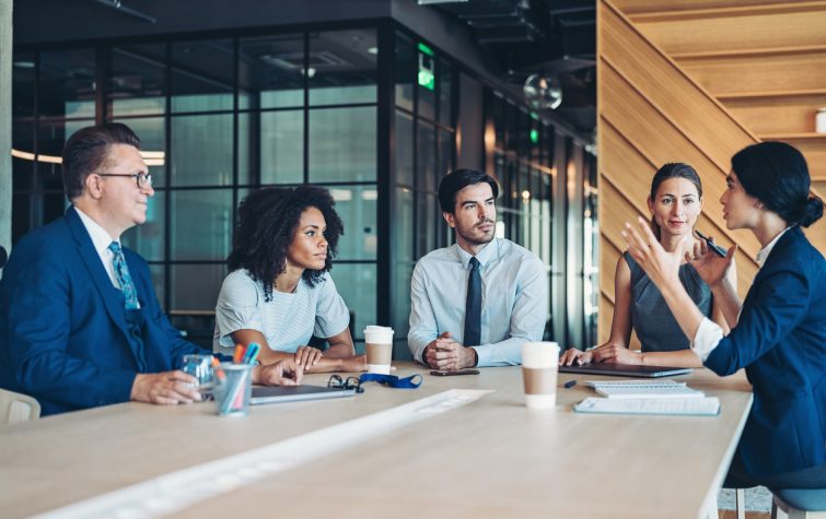 5 co-workers at a business meeting