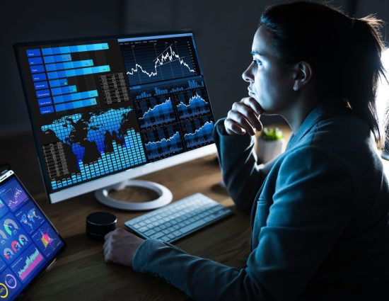 Woman looking at data on a desktop computer