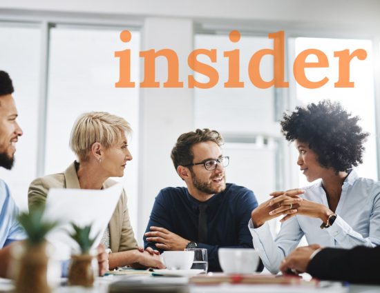 Team meeting around table with the word insider