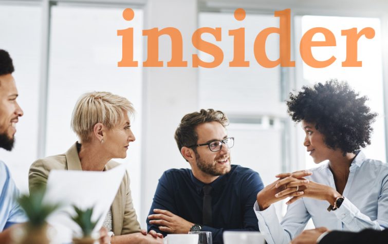 Team meeting around table with the word insider