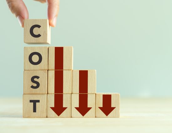 building blocks with downward arrows and the word cost to indicate reduction in cost