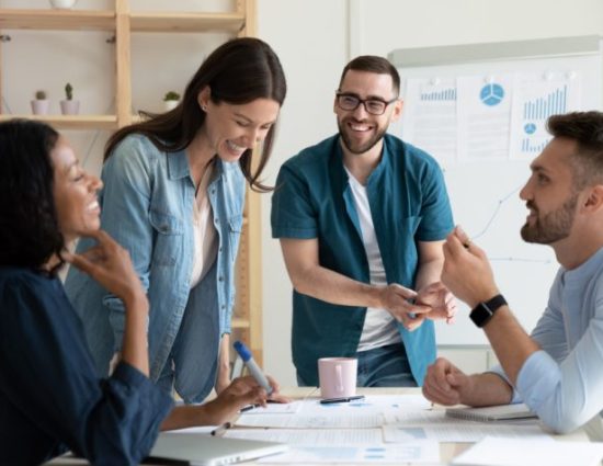 employees laughing in a conference room