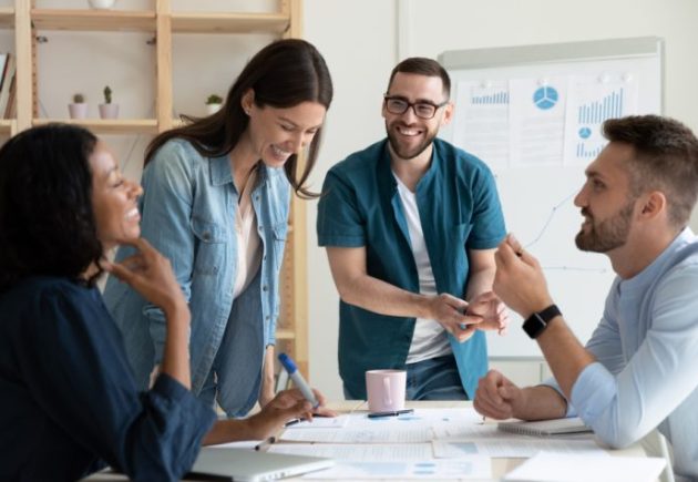 employees laughing in a conference room