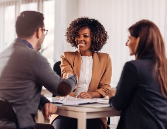 candidate shakes hands with employees in interview