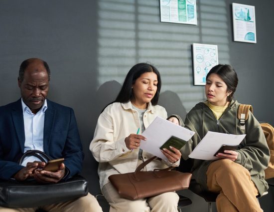 People checking on their work visa applications