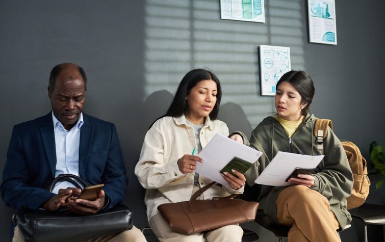 People checking on their work visa applications