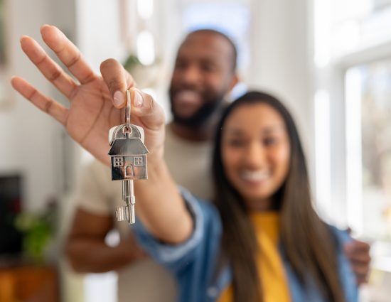 First-time homebuyers touring a forever home with a realtor