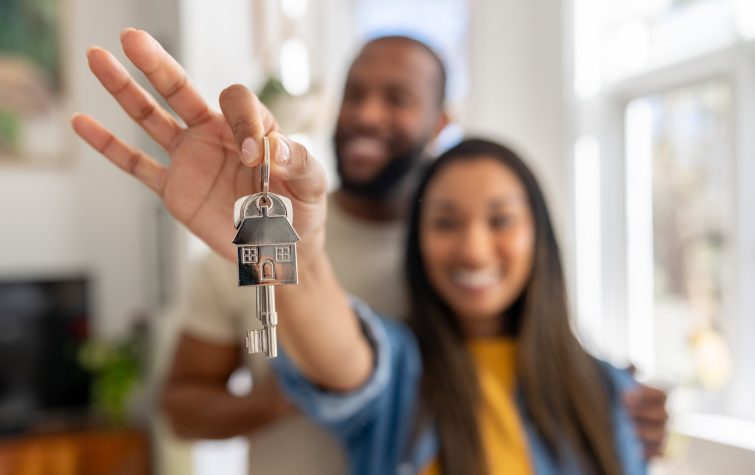 First-time homebuyers touring a forever home with a realtor