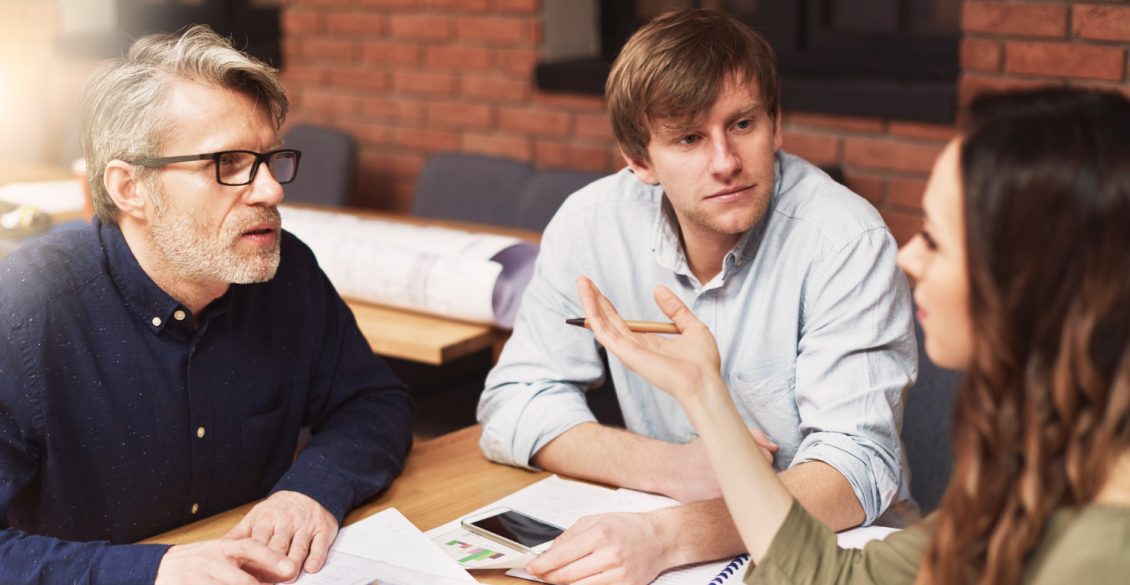 Mobility professionals discussing relocation expenses, tax, and compliance