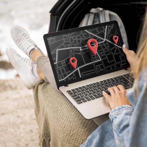 Transferee using a laptop map to search for housing in a new location