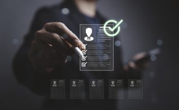 HR professional reviewing a digital checklist for mobility risk assessment and employment authorization compliance