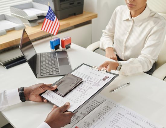Immigration specialist reviewing visa and work authorization documents in response to Supreme Court TPS rulings affecting global mobility programs