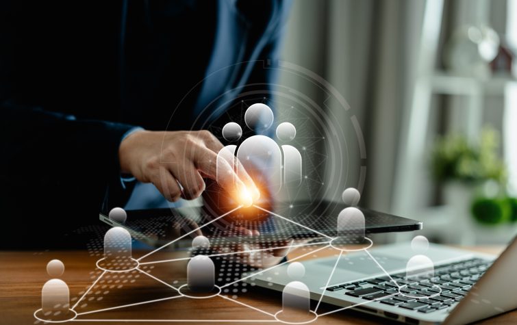HR professional managing a connected workforce for UK Skilled Worker Visa sponsorship