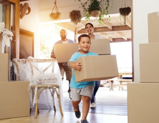 Relocated employee and family settling into their new home in the UK, illustrating a supported transferee experience.