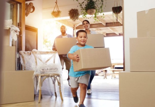 Relocated employee and family settling into their new home in the UK, illustrating a supported transferee experience.