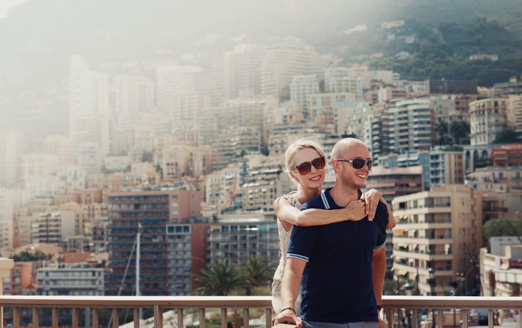 Couple in a new city apartment, illustrating the trailing spouse experience during a corporate relocation