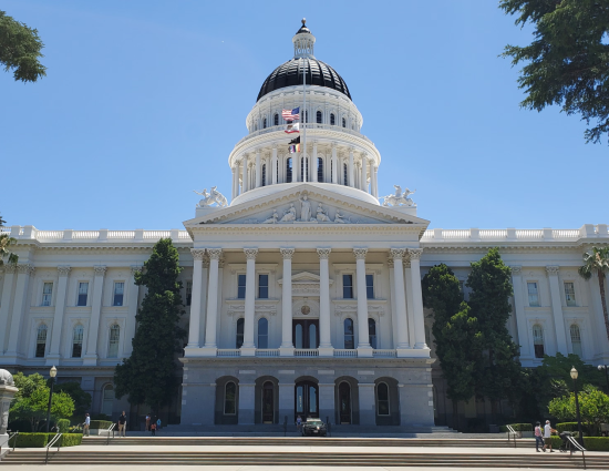 California State Capitol building representing AB 692 and AB 1697 legislation governing relocation repayment agreements and stay-or-pay provisions