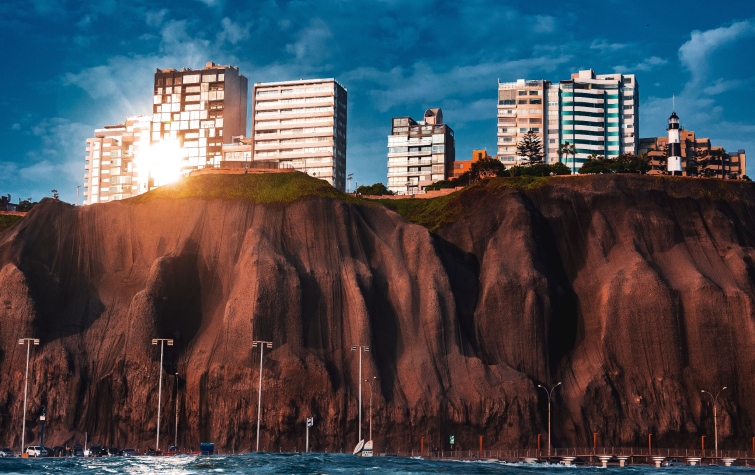 Apartment buildings above the coastal cliffs of Miraflores in Lima Peru representing temporary housing options for employees relocating internationally